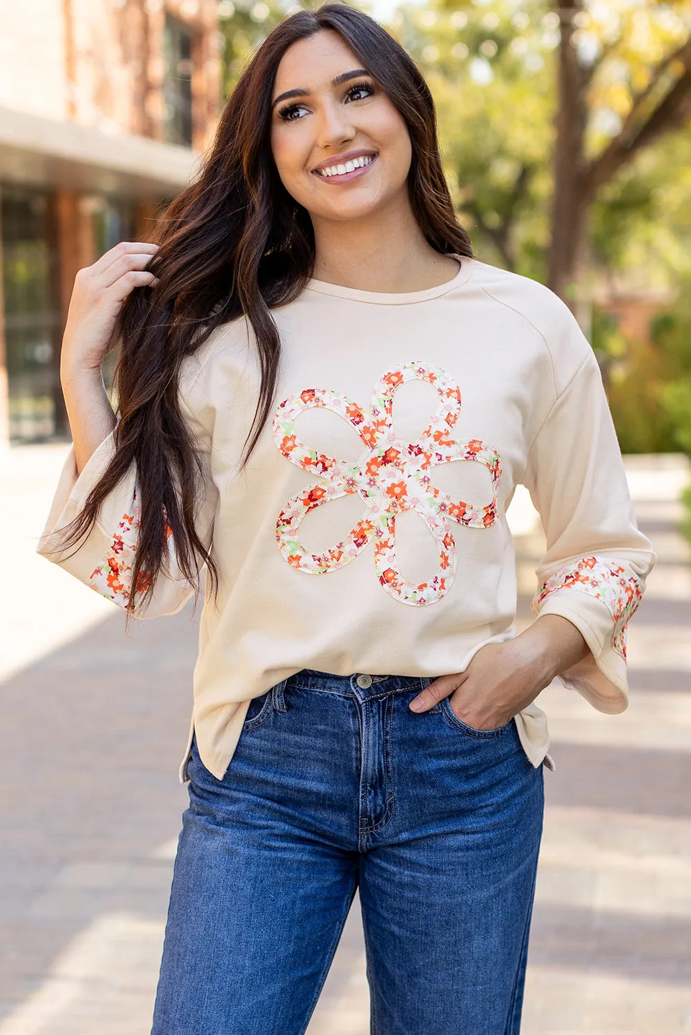 Flower Exposed Seam Wide Sleeve Top sold by Threaded Pear