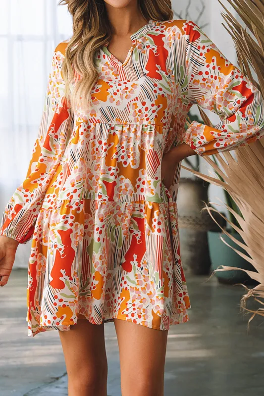 Daniella Split Neck Puff Sleeve Flowy Printed Dress sold by Threaded Pear
