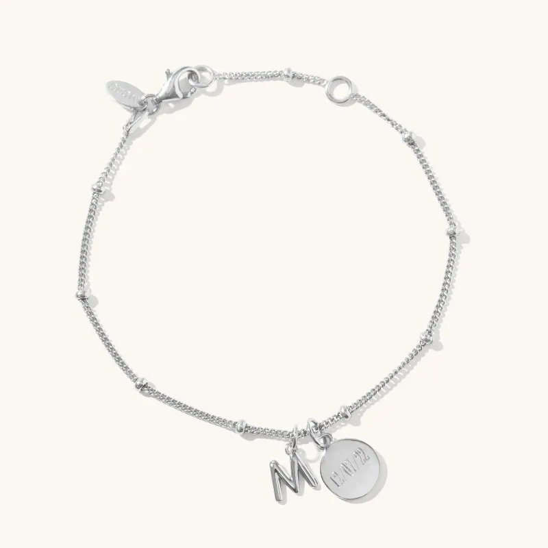 Personalised Disc & Letter Bracelet Silver sold by Muru
