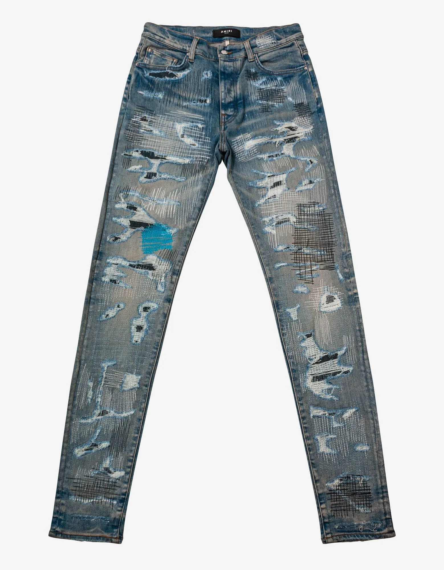 Amiri All Over Repair Clay Indigo Jeans sold by Zoo Fashions