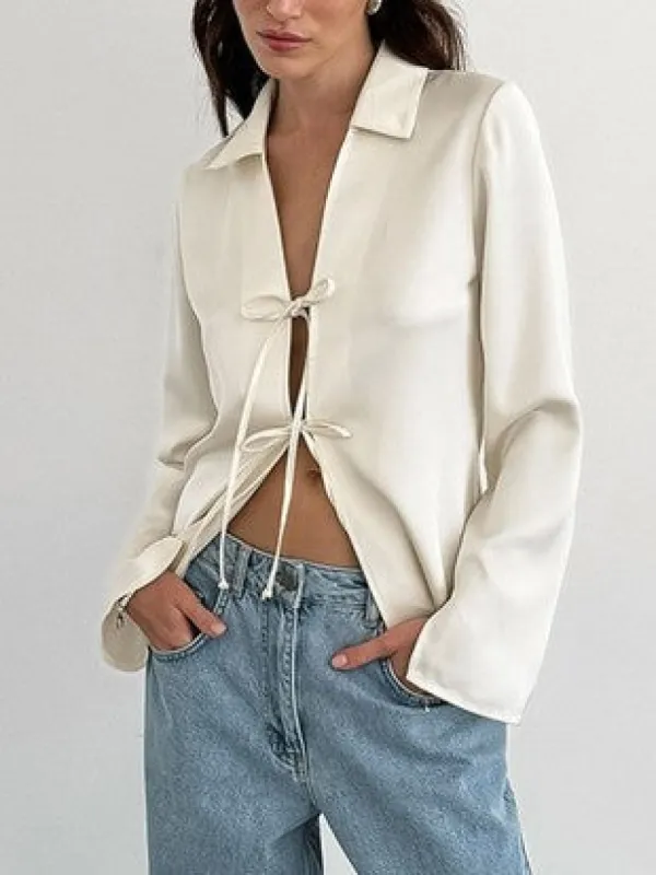 27 Tie Front Cutout Long Sleeve Blouse sold by 27 Boutique
