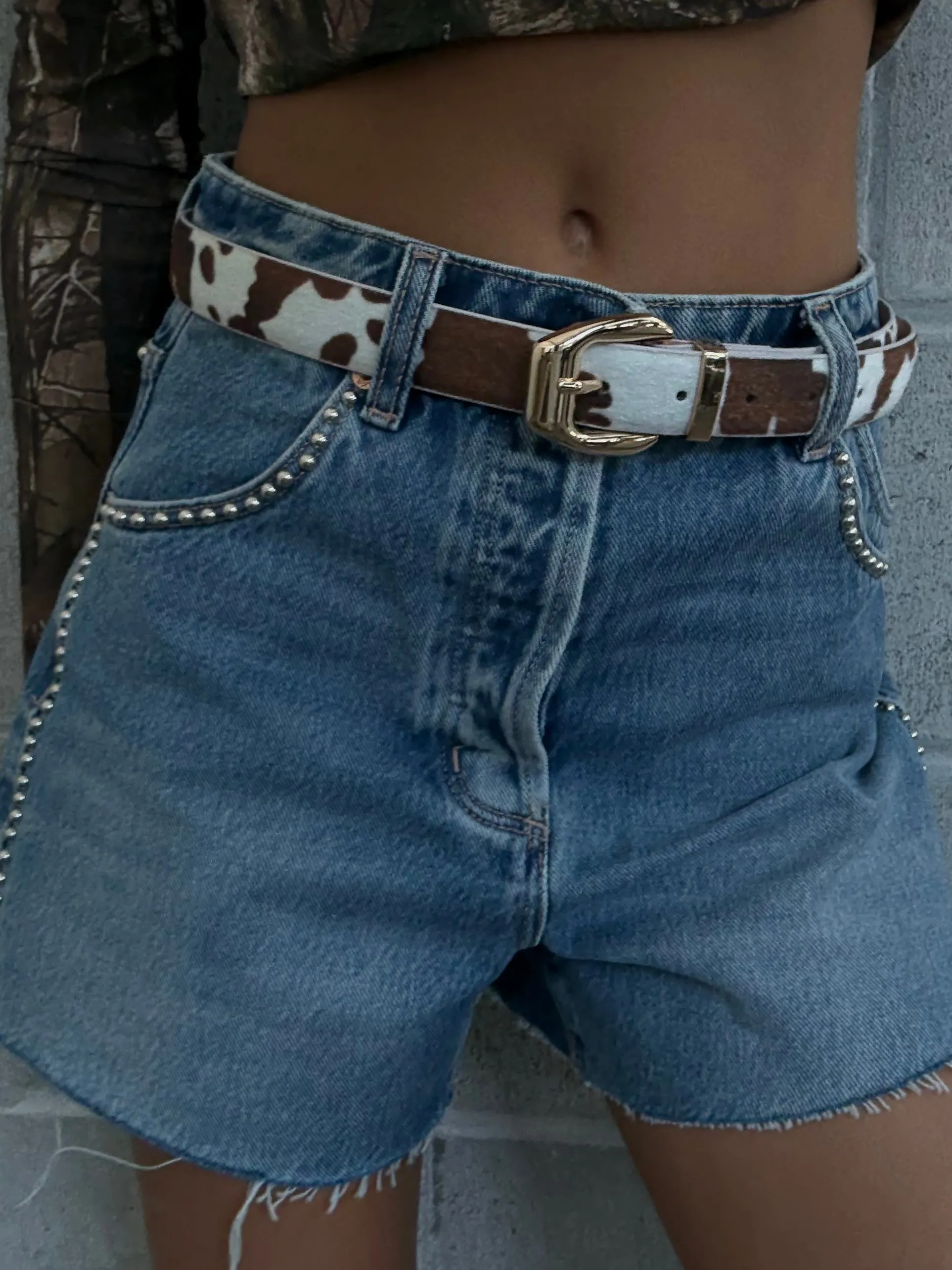 27 Squared Buckle Faux Fur Cow Print Belt sold by 27 Boutique