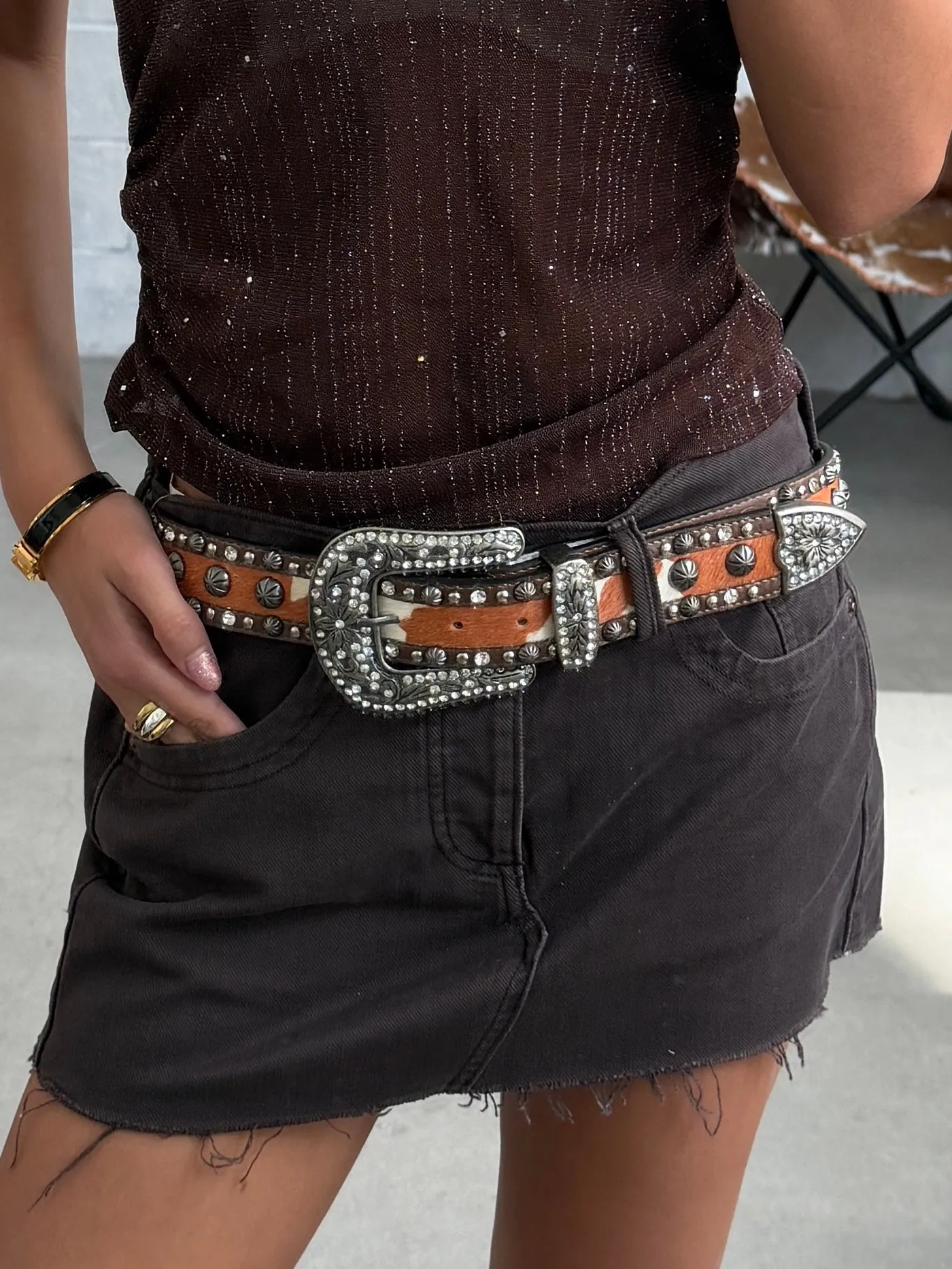 27 Rhinestone Studded Cow Print Western Belt sold by 27 Boutique