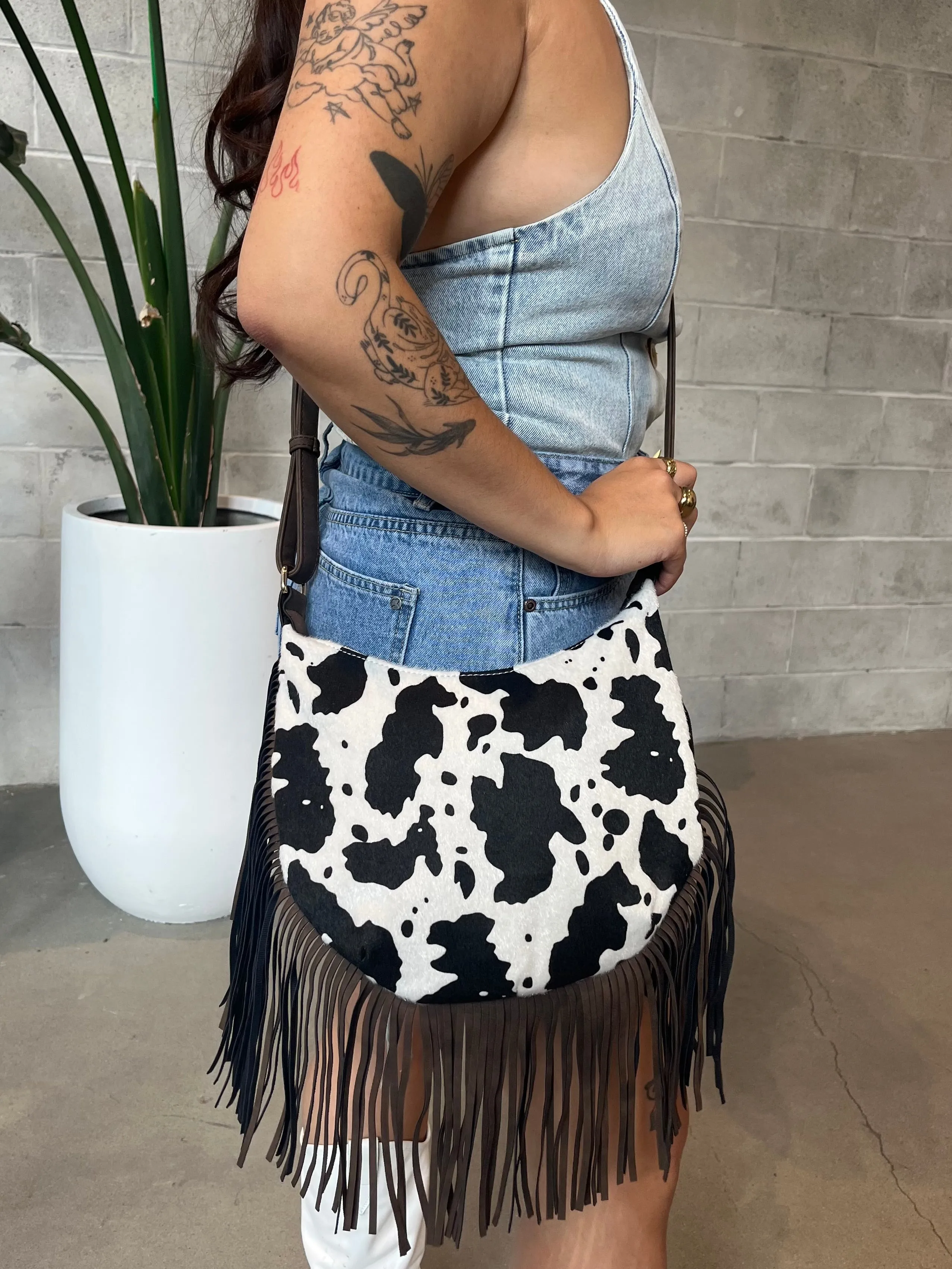 27 Western Cow Print Fringe Crossbody Bag sold by 27 Boutique