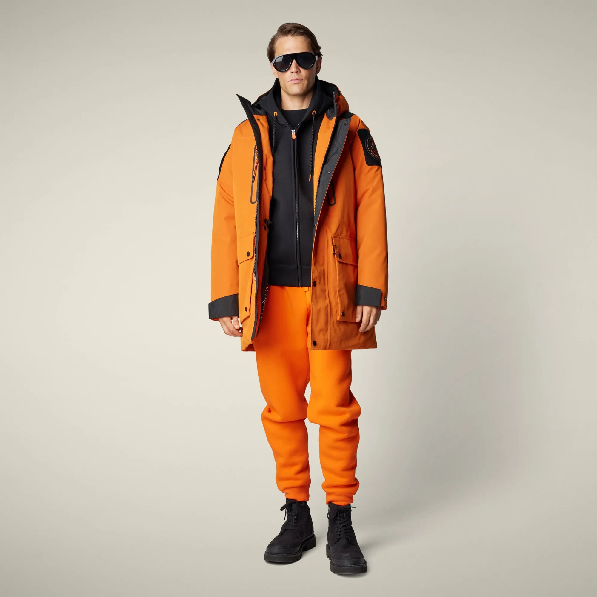 Men's Winter Parka Kailash in amber orange sold by Save The Duck