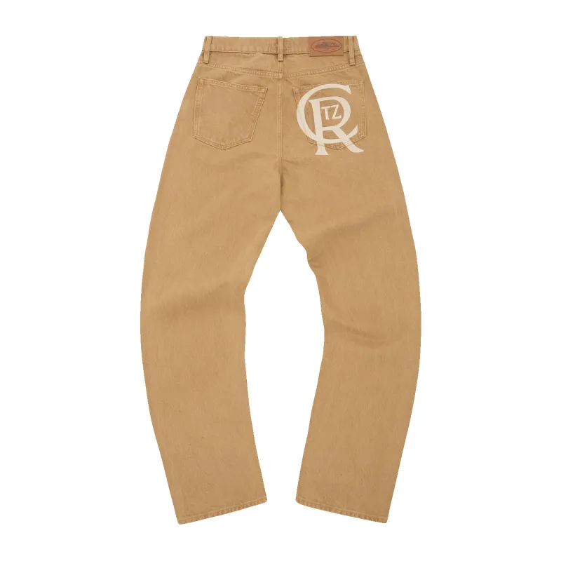 CREST CHAINSTITCH BAGGY JEANS [TAN] sold by Corteiz