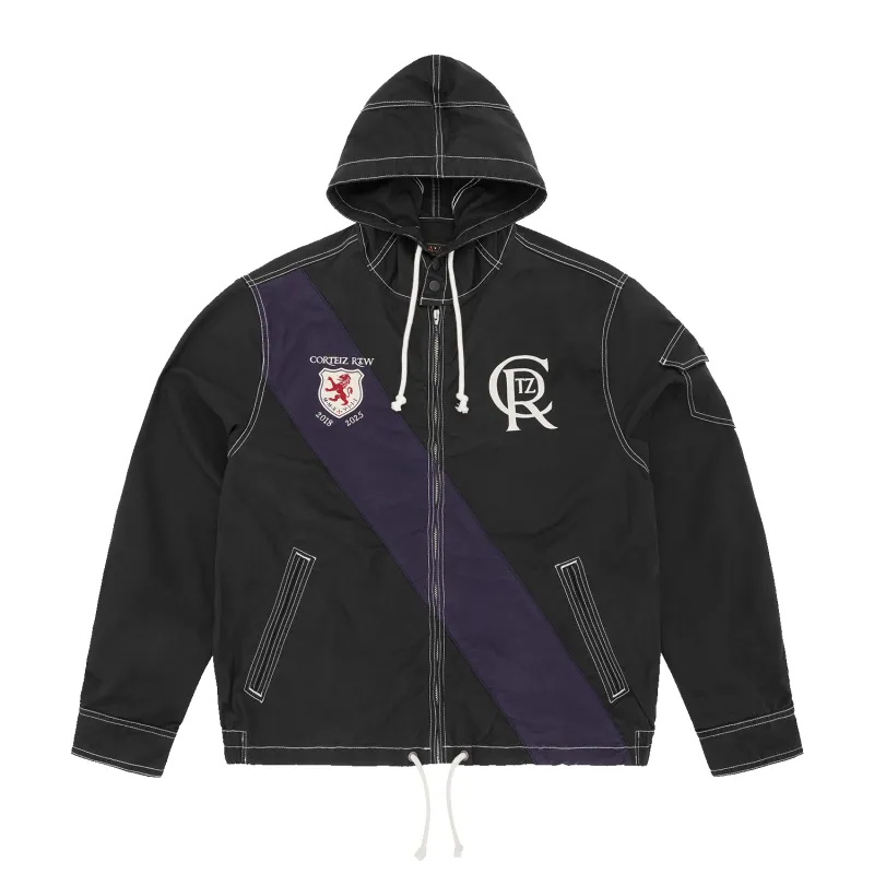 SHIELD CREST TWILL JACKET [BLACK] sold by Corteiz