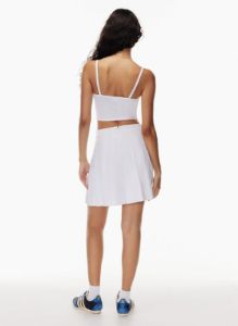 olive mini pleated skirt sold by Aritzia
