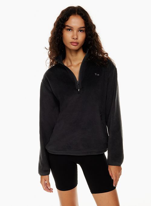 sno polar ¼ zip hip sweater sold by Aritzia