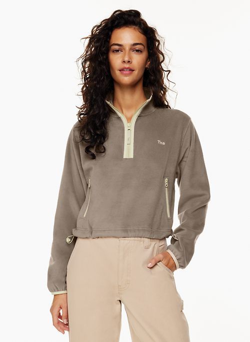 sno polar ½ zip sweater sold by Aritzia