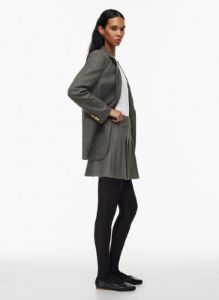 olive micro pleated skirt sold by Aritzia