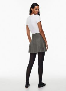 olive micro pleated skirt sold by Aritzia