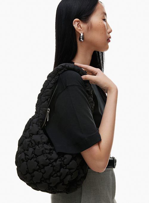 curator bag sold by Aritzia