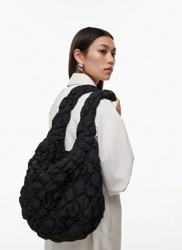 curator bigger bag sold by Aritzia