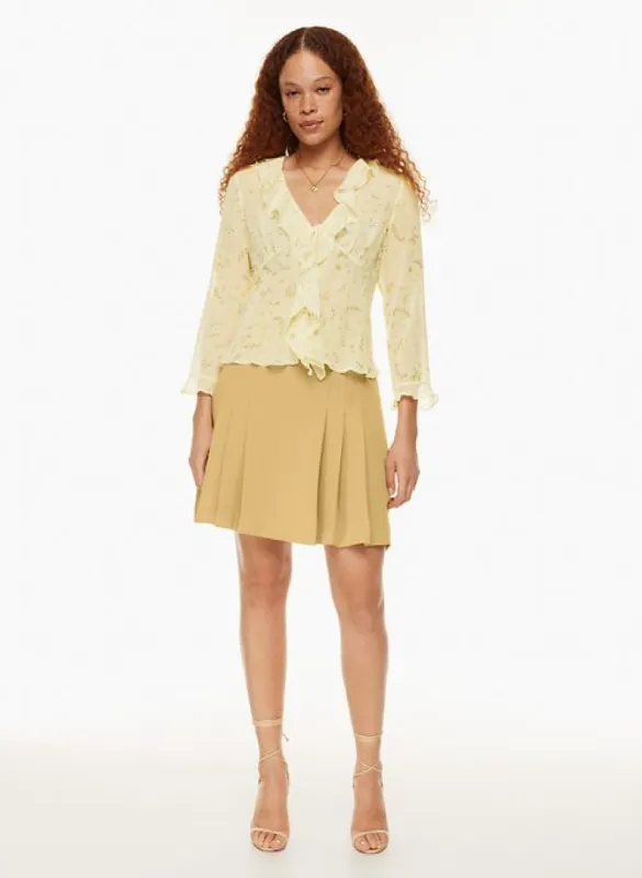 tapestry pleated skirt sold by Aritzia