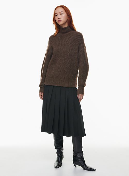 nestled sweater sold by Aritzia