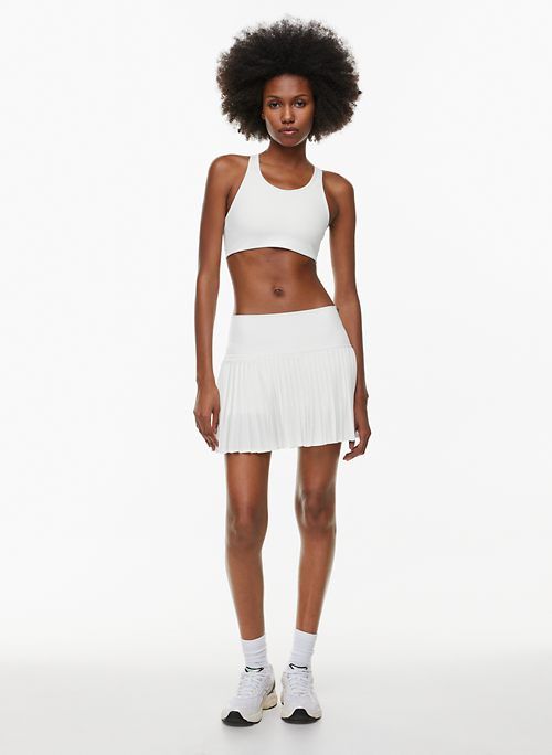 movetech™ cheeky score skirt sold by Aritzia