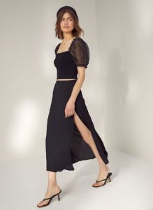 sheer-sleeve top sold by Aritzia