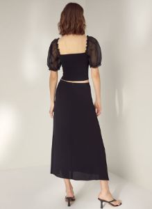 sheer-sleeve top sold by Aritzia
