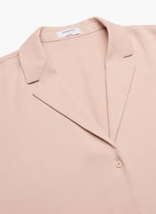 monocle shirt sold by Aritzia