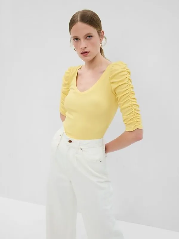 Featherweight Ruched Sleeve Rib Top sold by GAP
