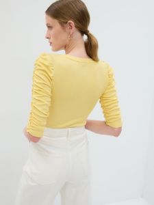 Featherweight Ruched Sleeve Rib Top sold by GAP