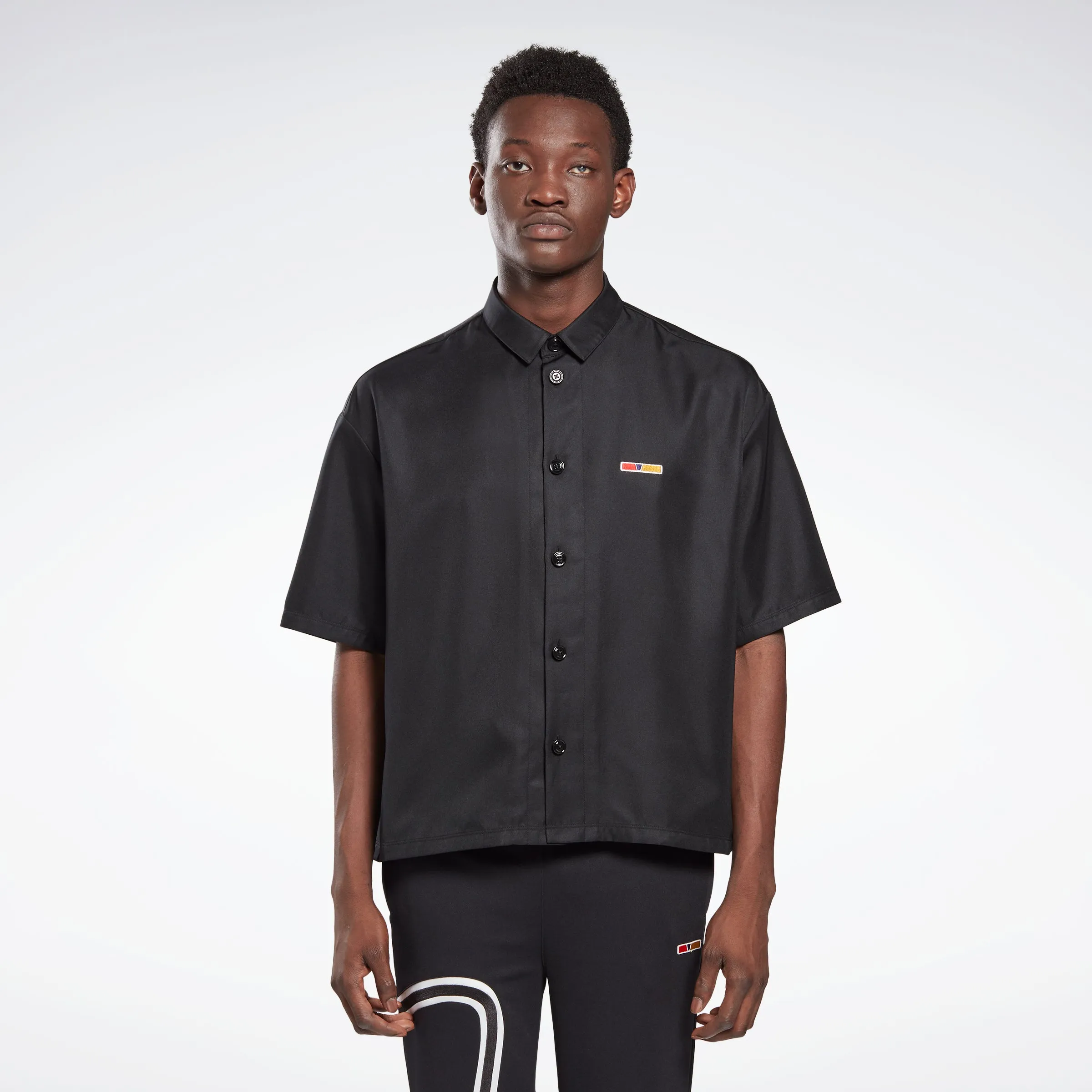 Reebok Apparel Men Reebok By Pyer Moss Short Sleeve Cropped Button-Down Shirt Black sold by Reebok