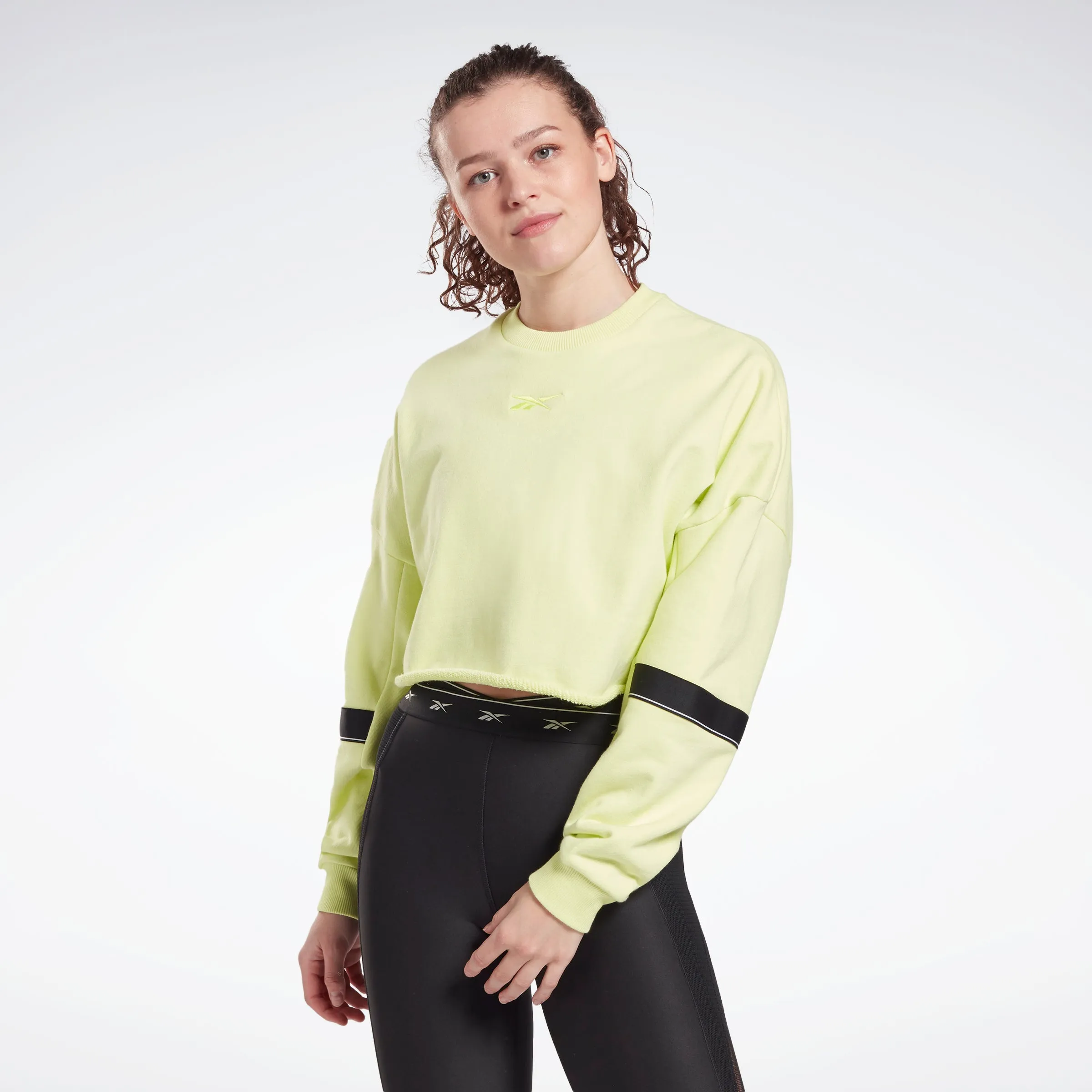 Reebok Apparel Women Studio Cropped French Terry Crew Sweatshirt Eneglw sold by Reebok