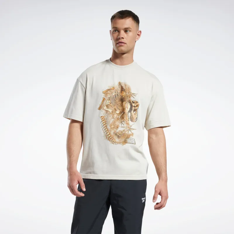 Reebok Apparel Men Jurassic World Fossil T-Shirt Stucco sold by Reebok