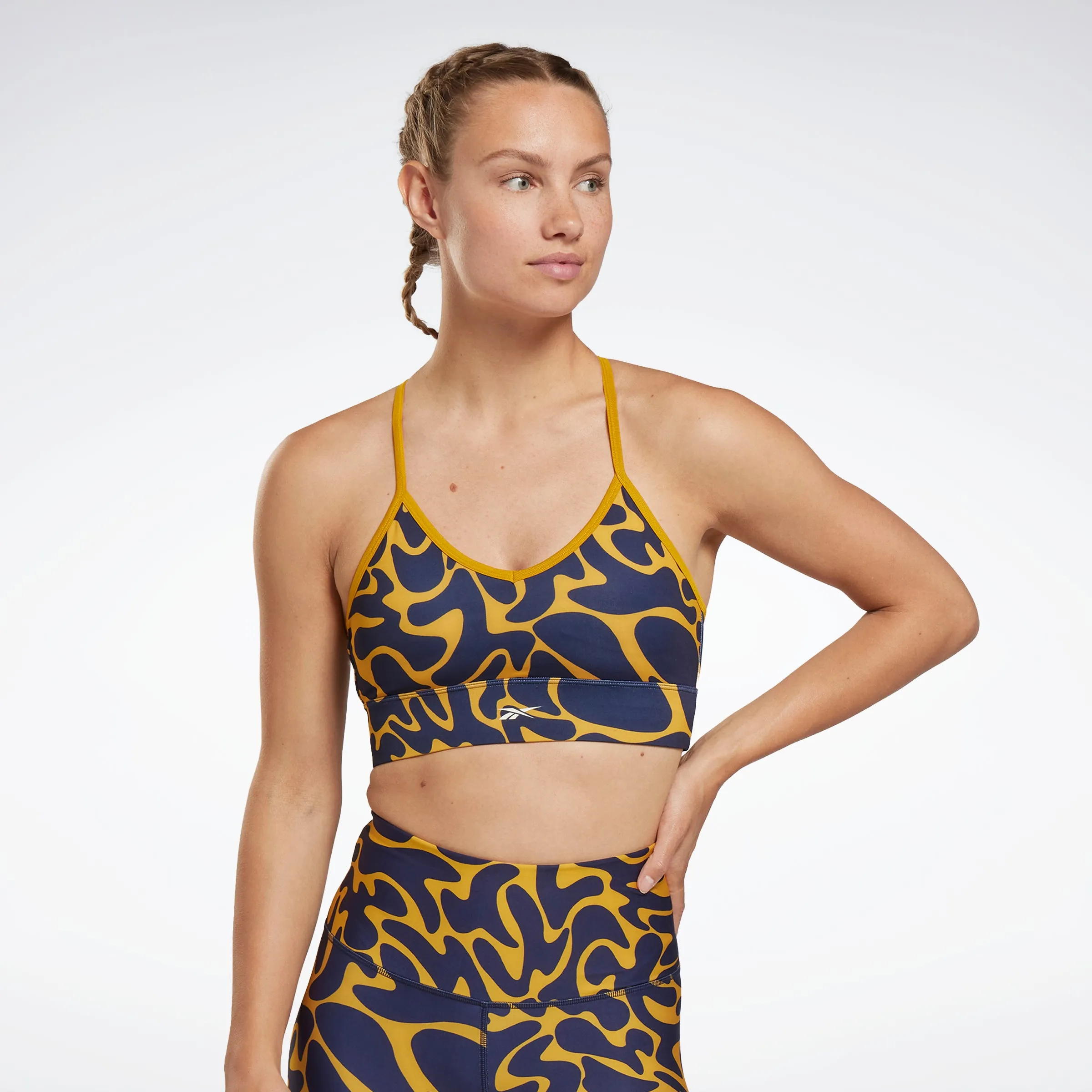 Reebok Apparel Women Workout Ready Sports Bra Bright Ochre sold by Reebok