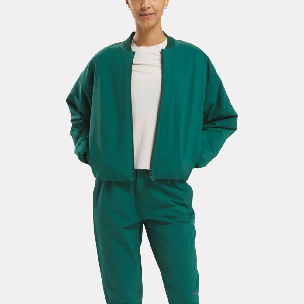 Reebok Apparel Women Active Collective SkyStretch Woven Padded Jacket COLLEGIATE GREEN sold by Reebok