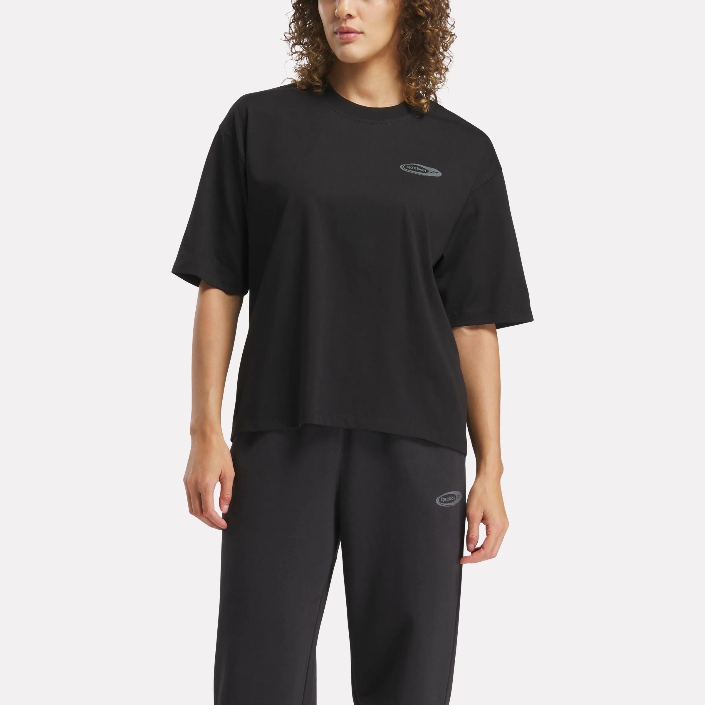 Reebok Apparel Women ID Energy Brand Proud T-Shirt BLACK sold by Reebok