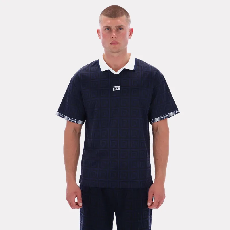 Reebok Apparel Men Reebok Monogram Graphic Jersey VECTOR NAVY AOP sold by Reebok