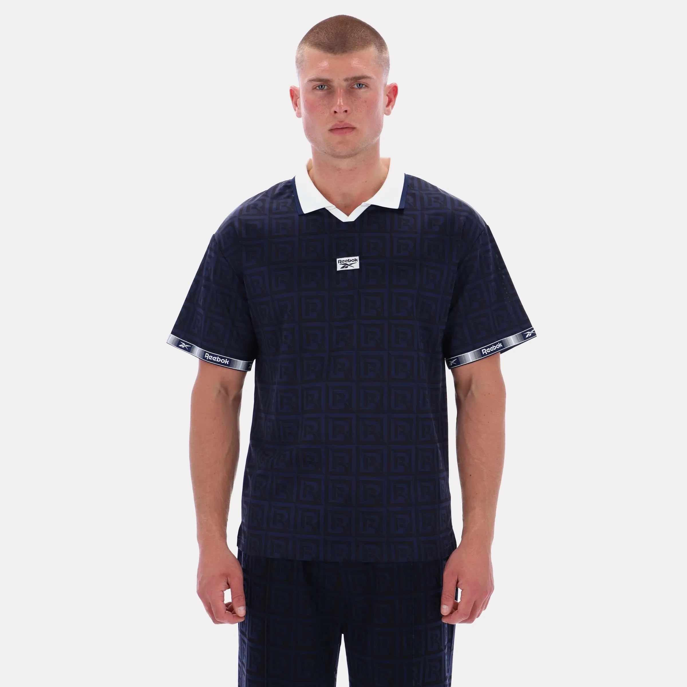 Reebok Apparel Men Reebok Monogram Graphic Jersey VECTOR NAVY AOP sold by Reebok