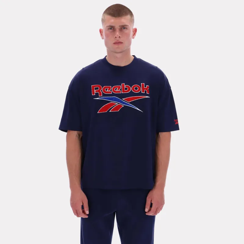 Reebok Apparel Men Reebok Varsity Graphic T-Shirt VECTOR NAVY sold by Reebok