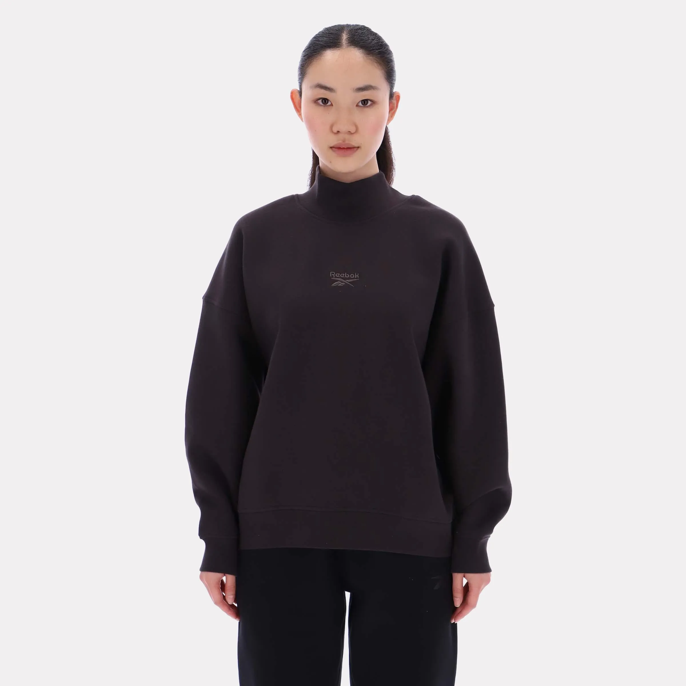 Reebok Apparel Women Longline Roll Neck Sweatshirt WASHED BLACK sold by Reebok