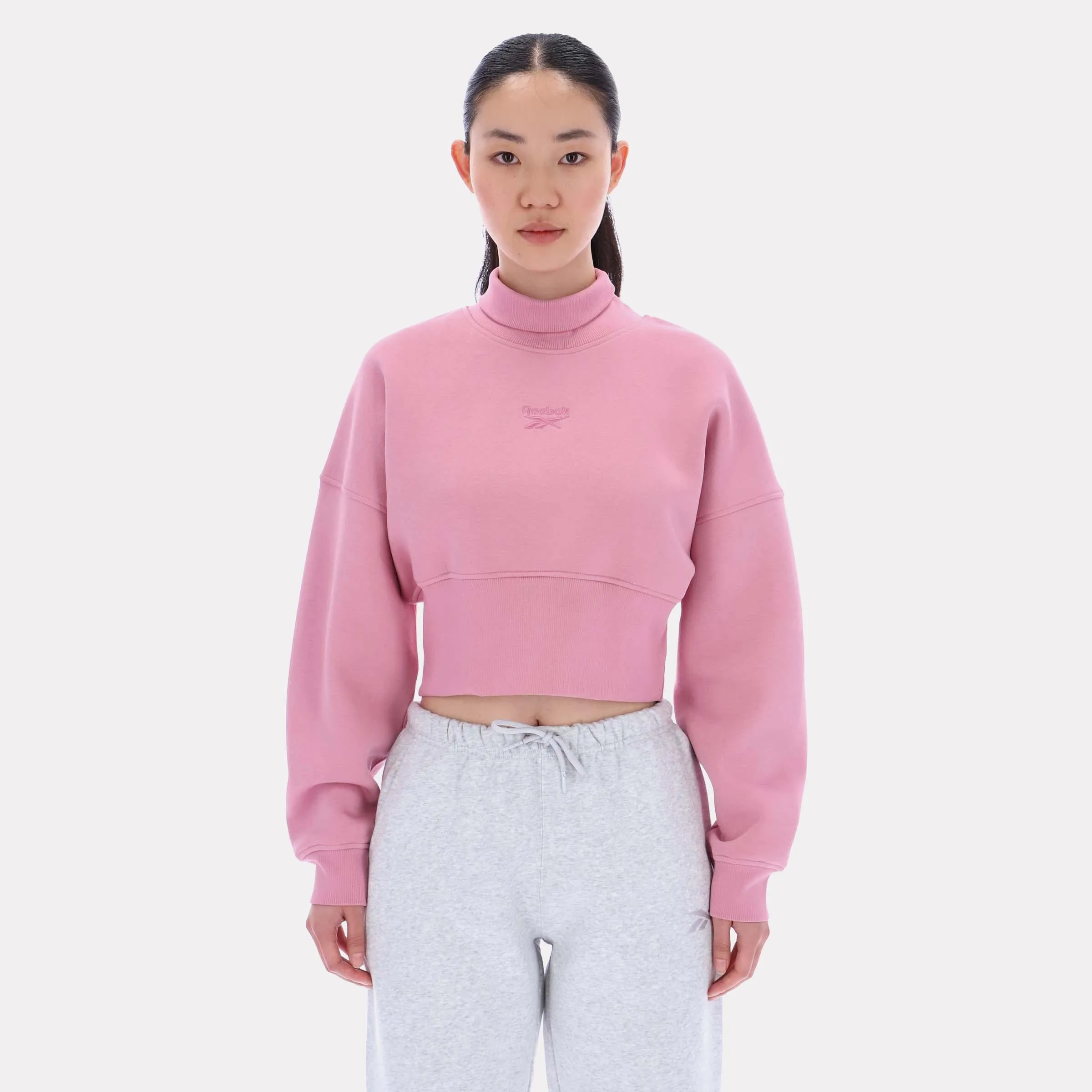 Reebok Apparel Women High Neck Cropped Sweatshirt DUSTY ROSE sold by Reebok