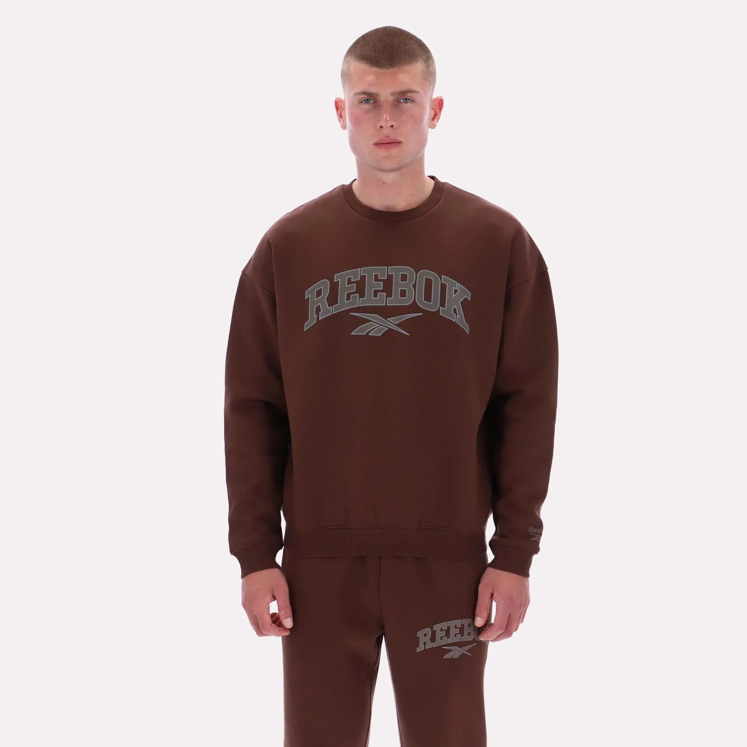 Reebok Apparel Men Varsity Graphic Sweatshirt CAMPUS BROWN sold by Reebok
