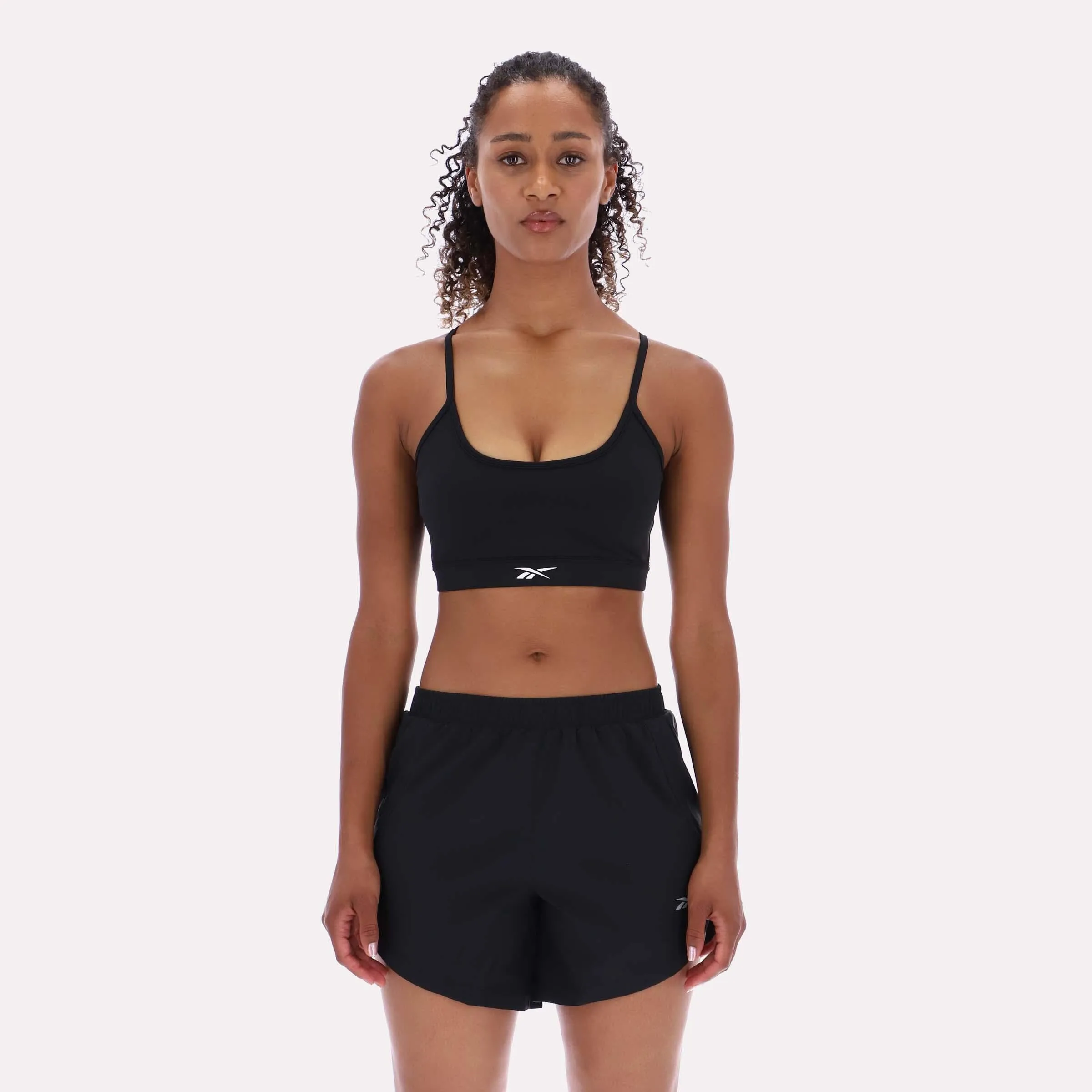 Reebok Apparel Women Core Strappy Bra - Medium Support BLACK sold by Reebok