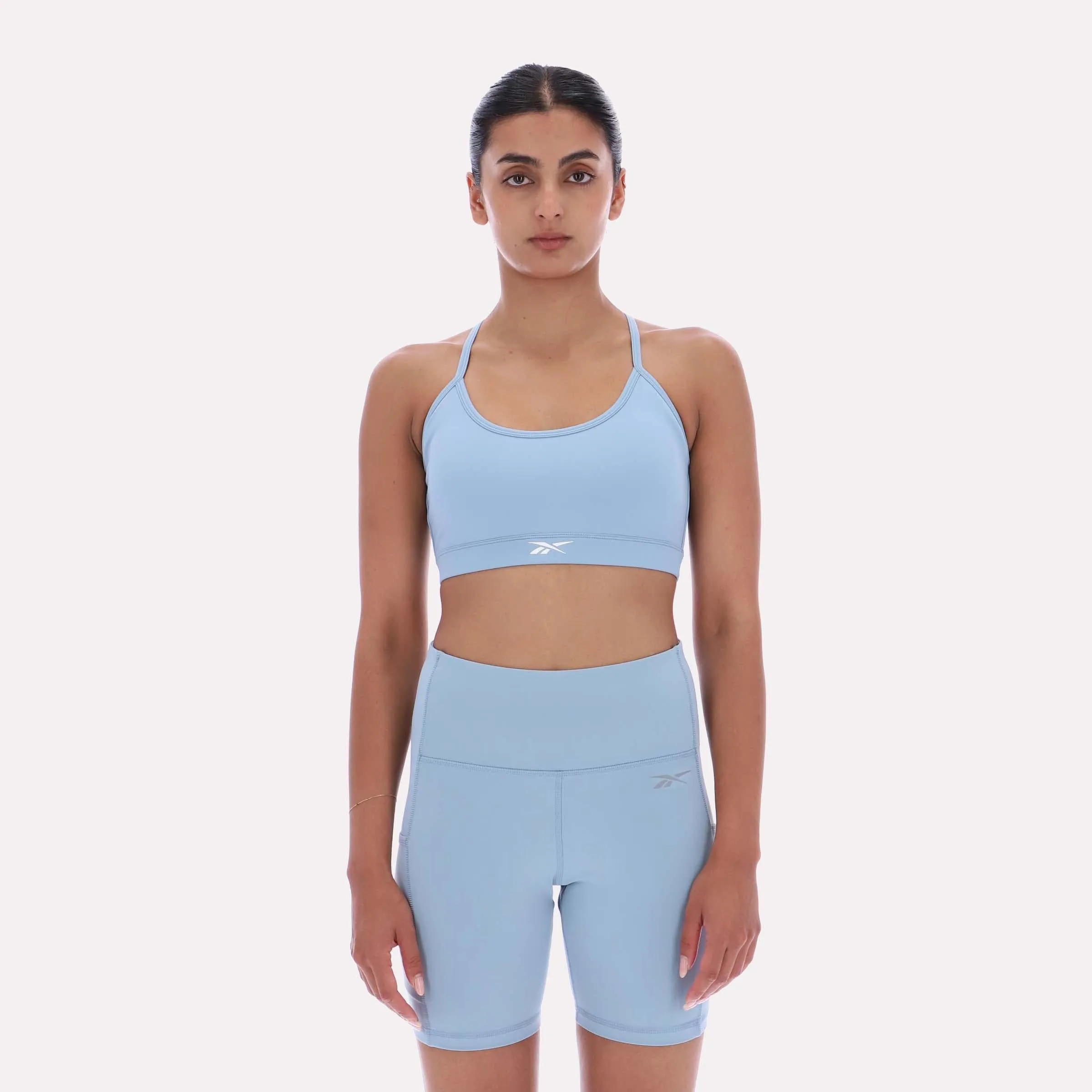Reebok Apparel Women Core Strappy Bra - Medium Support LEISURE BLUE sold by Reebok