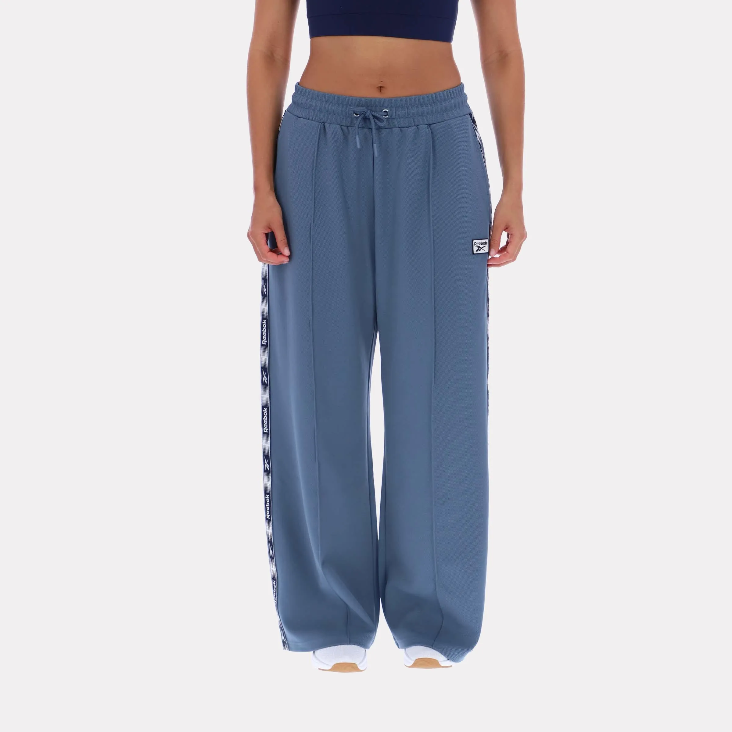 Reebok Apparel Women Classic Vector Track Pants LEISURE BLUE/SHADOW sold by Reebok