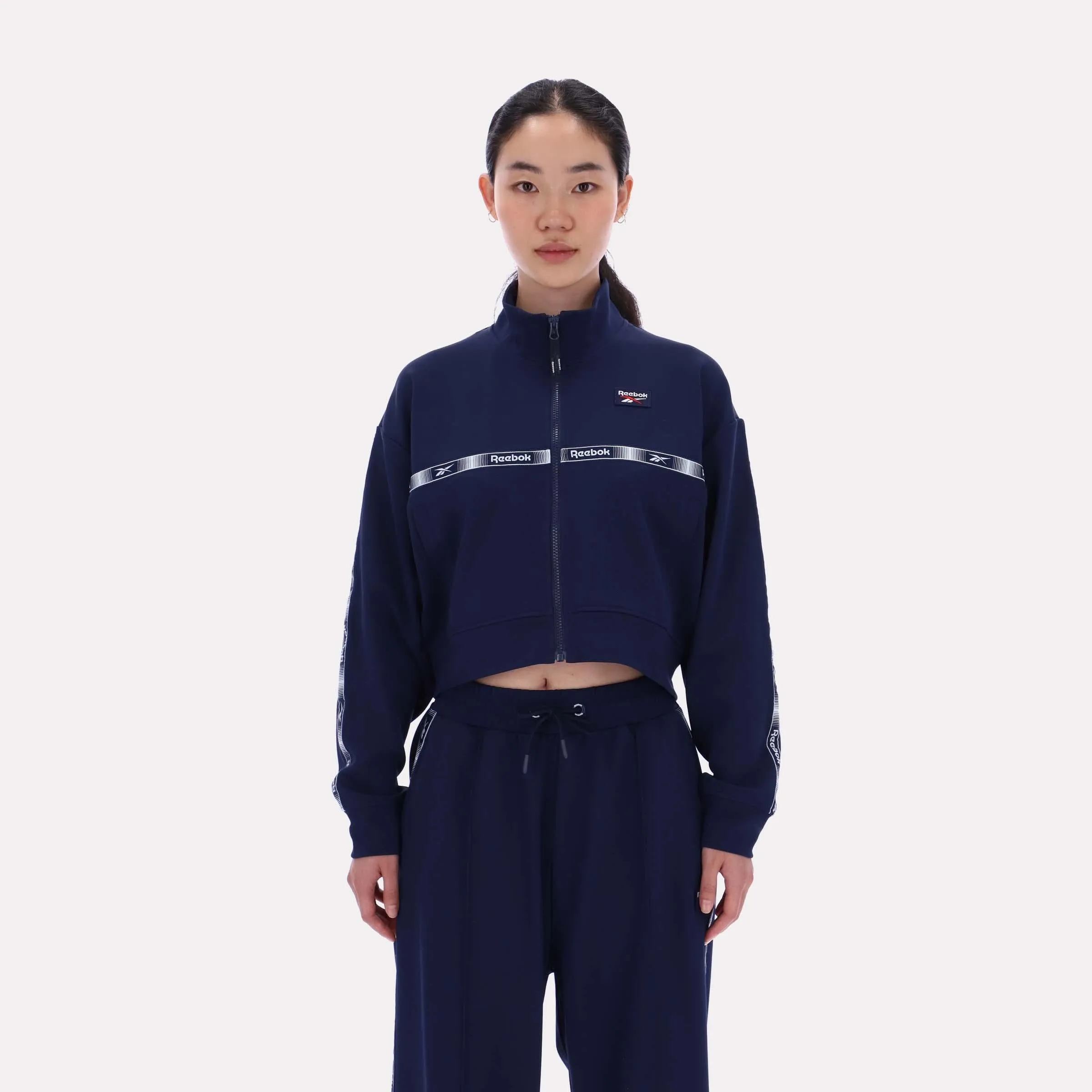 Reebok Apparel Women Cropped Vector Track Jacket VECTOR NAVY sold by Reebok