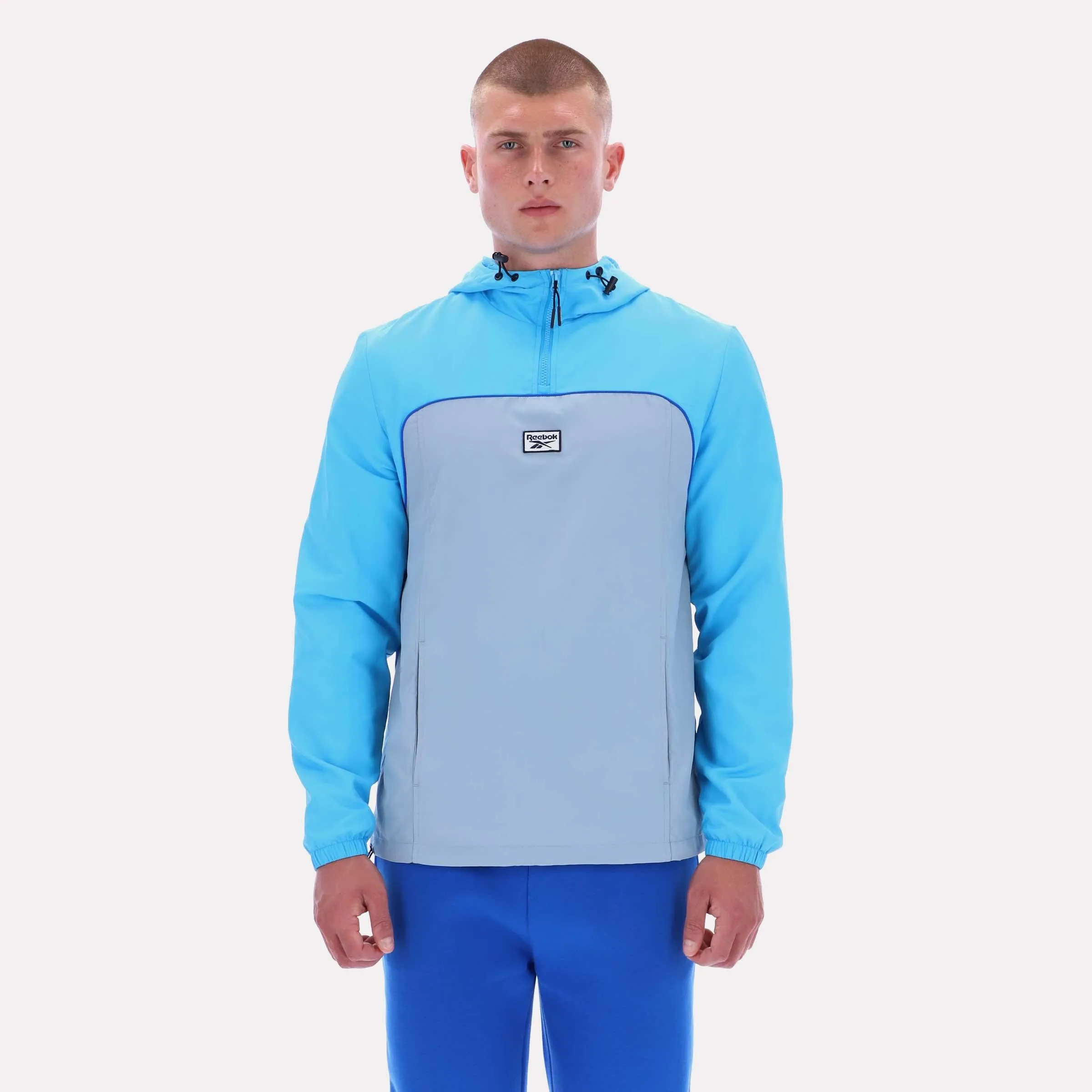 Reebok Apparel Men Heritage Sport Anorak FUTURE CYAN/LEISURE BLUE sold by Reebok