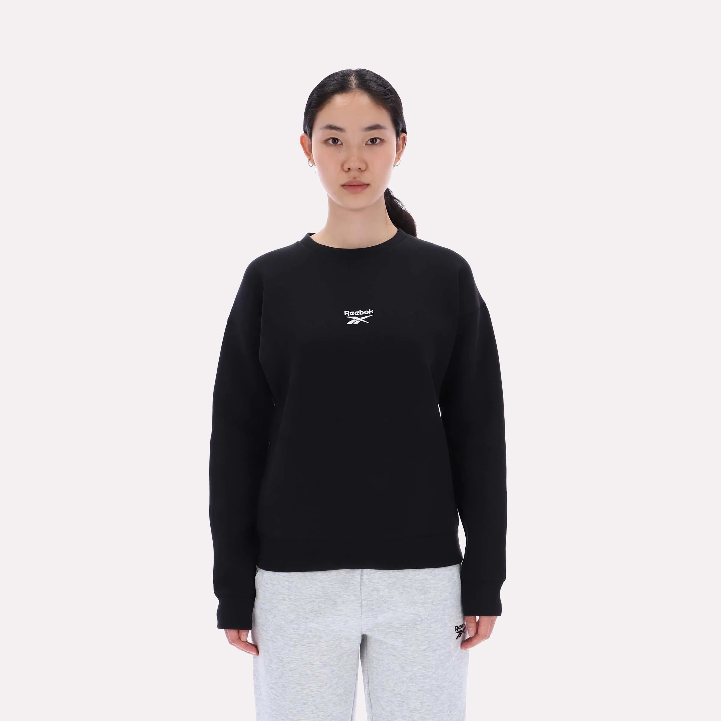 Reebok Apparel Women Reebok Small Logo Crew Sweatshirt BLACK sold by Reebok