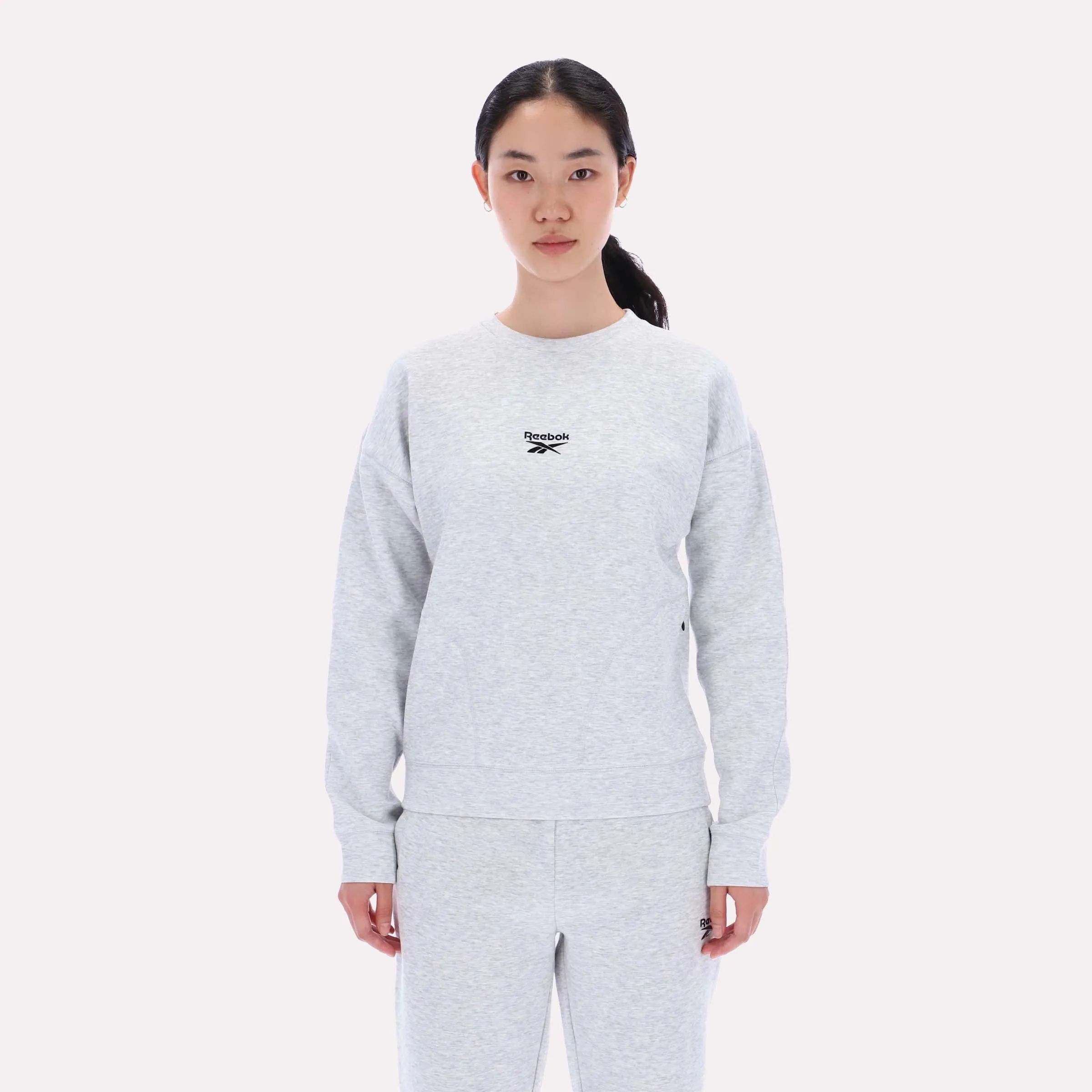 Reebok Apparel Women Reebok Small Logo Crew Sweatshirt SILVER MARL sold by Reebok