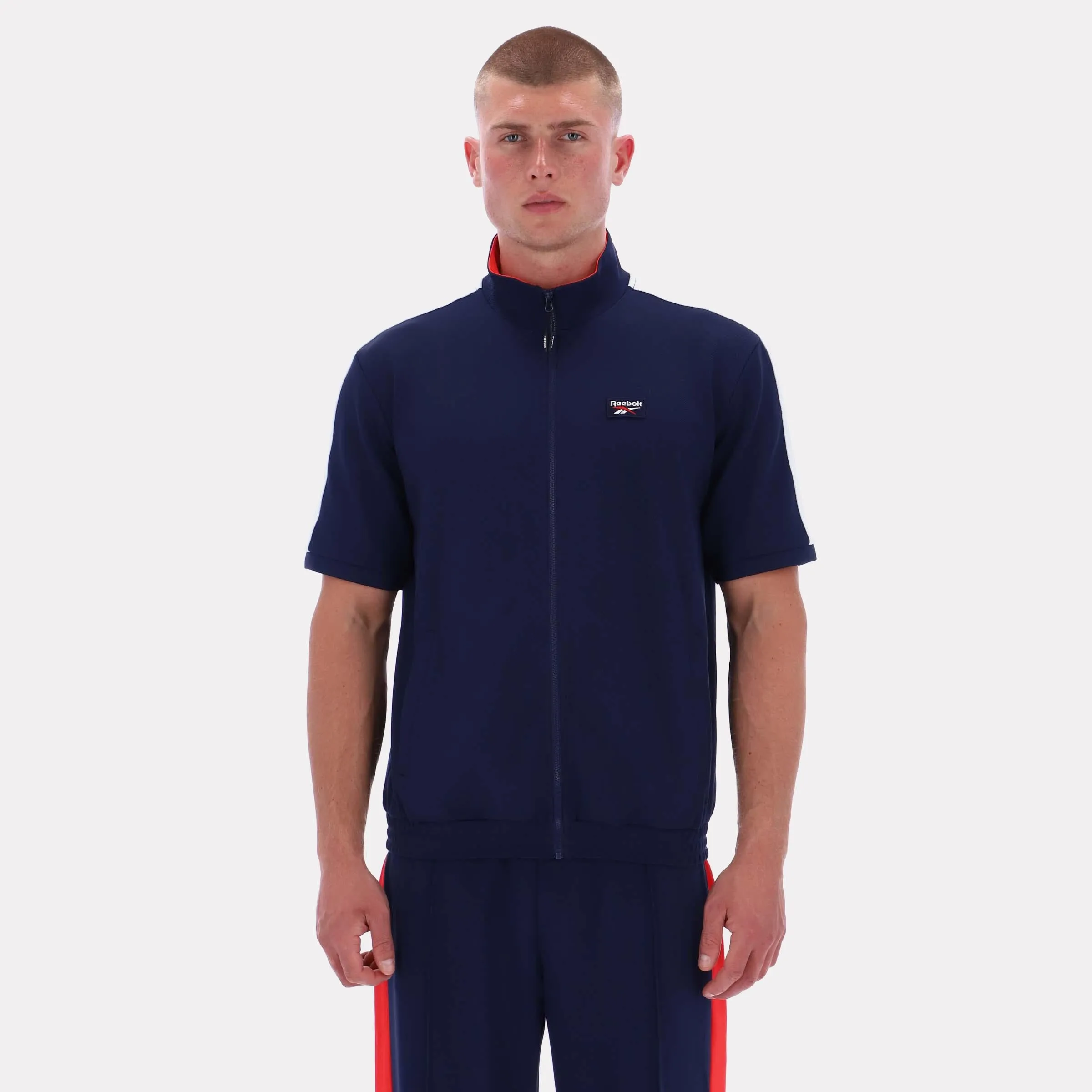 Reebok Apparel Men Short Sleeve Track Zip Shirt VECTOR NAVY sold by Reebok