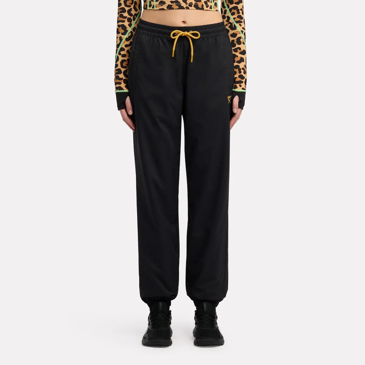 REEBOK APPAREL WOMEN Animal Print Vector Track Pants BLACK sold by Reebok