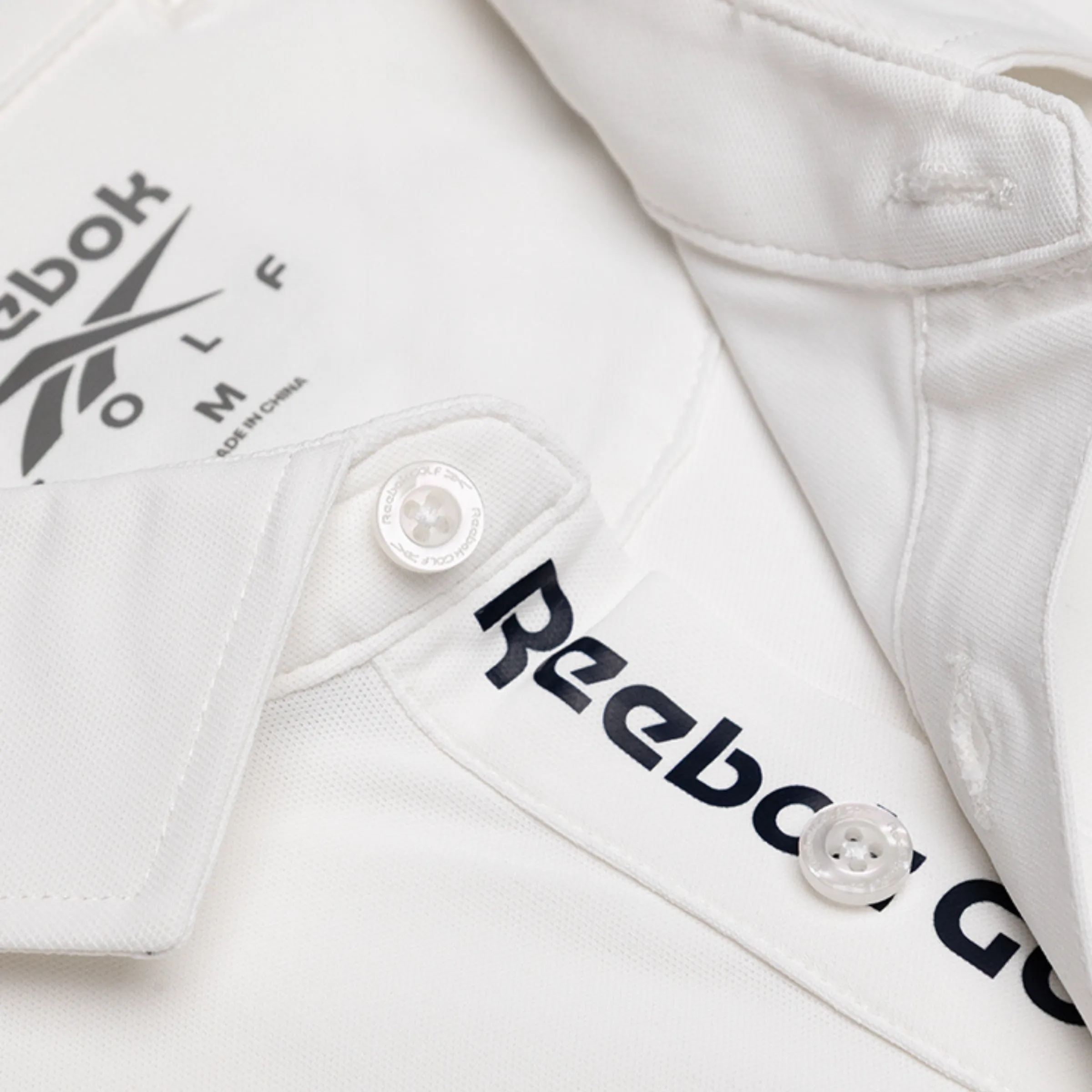 REEBOK APPAREL MEN Golf Bonded Pique Polo Shirt POLO WHITE sold by Reebok product image thumbnail 4