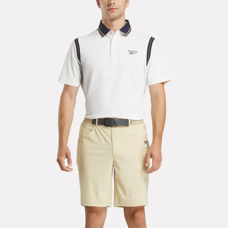 REEBOK APPAREL MEN Varsity Golf Short Sleeve Polo CHALK/GOLD/VECTOR NAVY made by Reebok