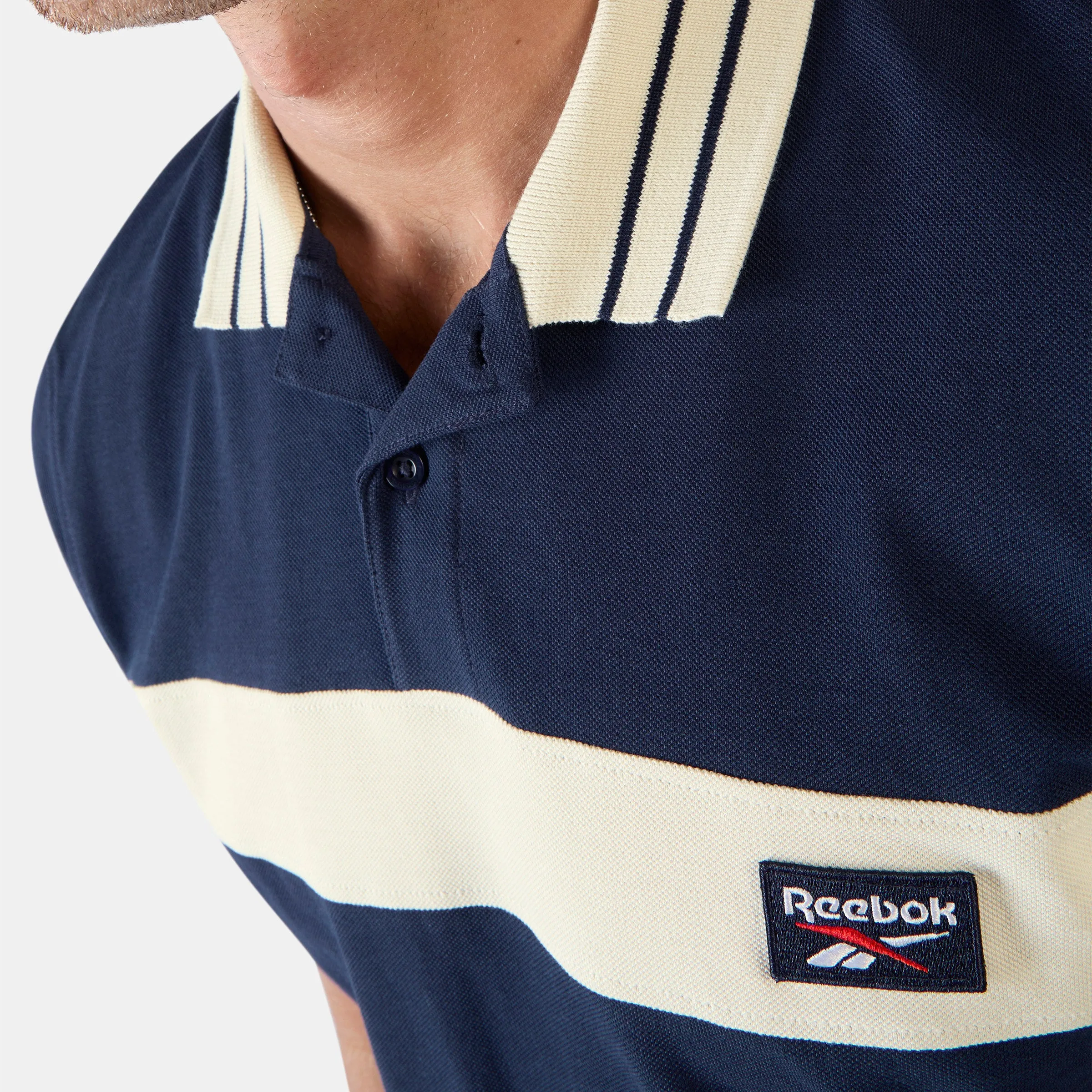 REEBOK APPAREL MEN Heritage Paneled Piqué Polo Shirt VECTOR NAVY/LINEN sold by Reebok product image thumbnail 4
